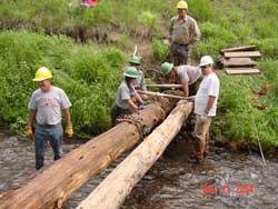 setting logs in place for new footbridge